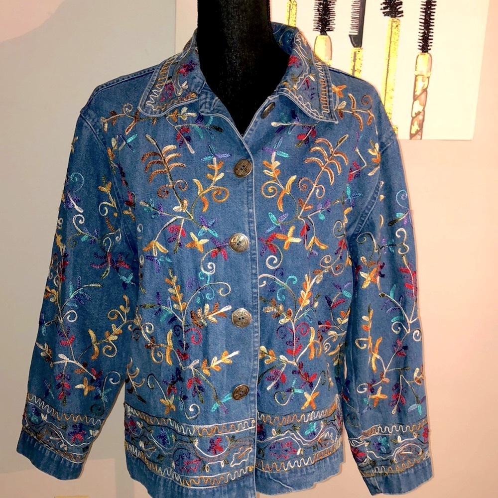 Units brand blue jean jacket embroidered multi colored designs throughout